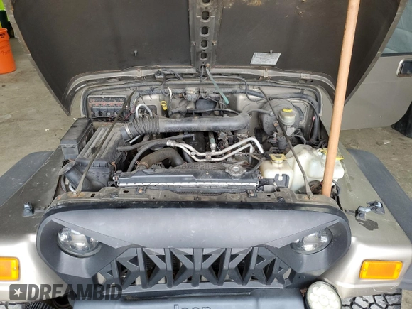 2005 Jeep Wrangler Sport z VIN 1J4FA49S75P325028, wystawiony jako Copart lot #56942315 z przebiegiem 169 988 mil mil oraz Szkoda całkowita • Salvage title. Historia ofert i sprzedaży dostępna na DreamBid. Obrazek 11.