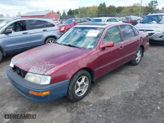 1997 Toyota Avalon XL with VIN 4T1BF12B5VU185685, listed as a IAAI auction lot 42037605 with 150,999 mi miles. Bid and sale history available at carsss.com. Image 2.