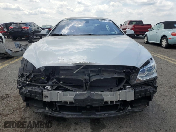 2015 BMW 6 Series 640i xDrive z VIN WBA6B8C53FD453229, wystawiony jako Copart lot #60371214 z przebiegiem 116 624 mil mil oraz Szkoda całkowita • Salvage title. Historia ofert i sprzedaży dostępna na DreamBid. Obrazek 5.