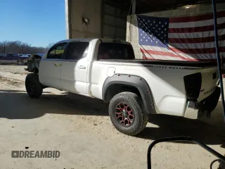 2021 Toyota Tacoma 4WD SR5 with VIN 3TMDZ5BN4MM103311, listed as a Copart auction lot 46486445 with 125,685 mi miles and Salvage Title. Bid and sale history available at carsss.com. Image 2.