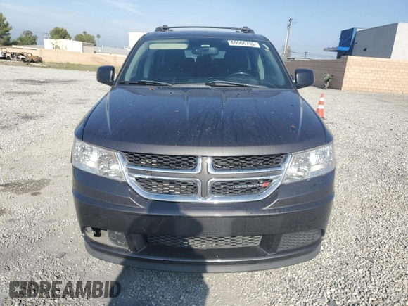2014 Dodge Journey American Value with VIN 3C4PDCABXET277897, listed as a Copart auction lot 60566735 with 113,343 mi miles and Salvage title. Bid and sale history available at DreamBid. Image 5.