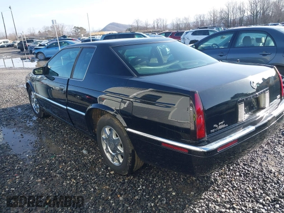 1999 Cadillac Eldorado Touring z VIN 1G6ET129XXU603042, wystawiony jako IAAI lot #41699955 z przebiegiem 81 704 mil mil oraz . Historia ofert i sprzedaży dostępna na DreamBid. Obrazek 3.