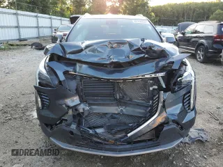 2019 Cadillac XT4 FWD Premium Luxury z VIN 1GYFZCR47KF123621, wystawiony jako Copart lot #69766894 z przebiegiem 68 191 mil mil oraz Szkody całkowita. Historia ofert i sprzedaży dostępna na DreamBid. Obrazek 5.