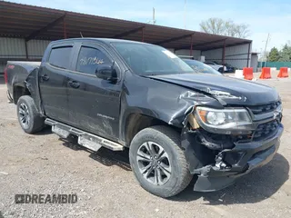 2021 Chevrolet Colorado 4WD Z71 z VIN 1GCGTDEN1M1256939, wystawiony jako IAAI lot #42071364 z przebiegiem 38 972 mil mil oraz . Historia ofert i sprzedaży dostępna na DreamBid. Obrazek 1.
