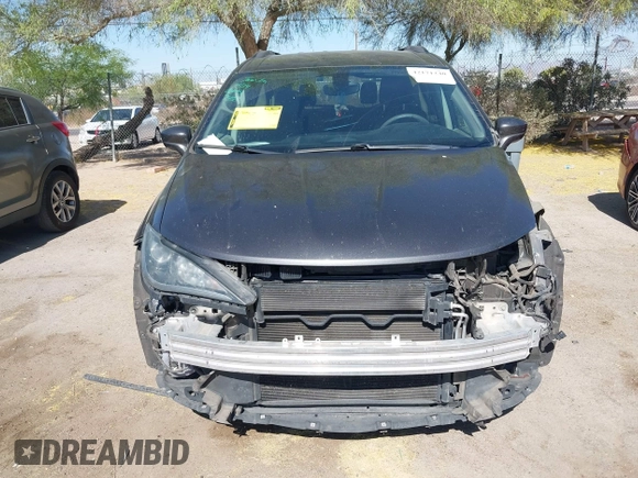 2017 Chrysler Pacifica Touring L with VIN 2C4RC1BG0HR826881, listed as a IAAI auction lot 42171240 with 214,188 mi miles and . Bid and sale history available at DreamBid. Image 12.