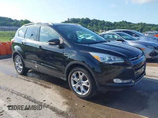 2016 Ford Escape Titanium z VIN 1FMCU9J97GUC21242, wystawiony jako IAAI lot #42431567 z przebiegiem 96 946 mil mil oraz . Historia ofert i sprzedaży dostępna na DreamBid. Obrazek 1.
