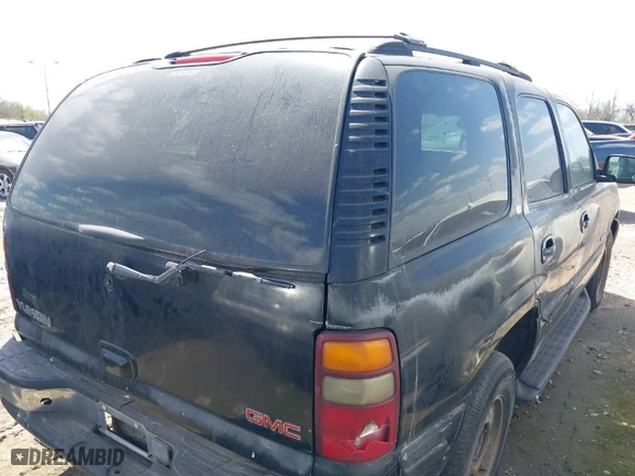 2001 GMC Yukon SLT with VIN 1GKEC13T11J308321, listed as a IAAI auction lot 41638407 with 242,827 mi miles. Bid and sale history available at carsss.com. Image 4.