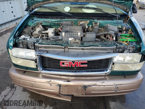 2003 GMC Safari z VIN 1GKEL19X83B512525, wystawiony jako Copart lot #79059984 z przebiegiem 122 800 mil mil oraz Szkody całkowita. Historia ofert i sprzedaży dostępna na DreamBid. Obrazek 12.