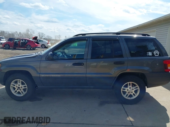 2003 Jeep Grand Cherokee Laredo with VIN 1J4GX48S53C504225, listed as a IAAI auction lot 41879669 with 247,246 mi miles. Bid and sale history available at carsss.com. Image 15.