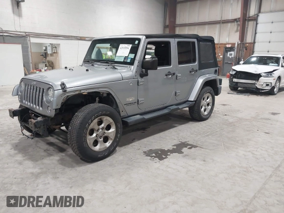 2014 Jeep Wrangler Unlimited Sahara with VIN 1C4BJWEG5EL164350, listed as a IAAI auction lot 42018586 with 113,222 mi miles. Bid and sale history available at carsss.com. Image 2.