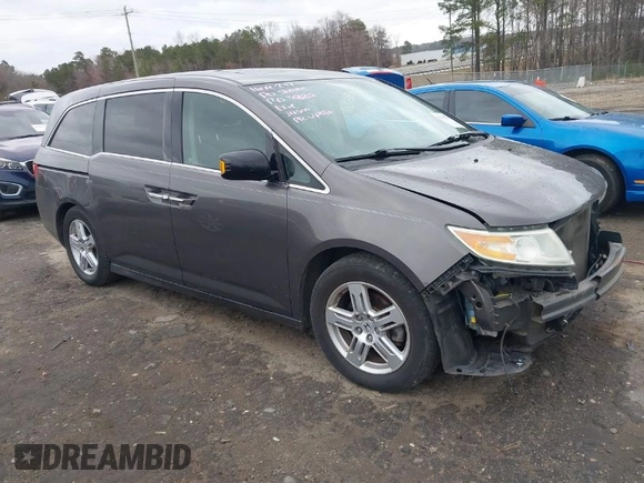 2012 Honda Odyssey Touring with VIN 5FNRL5H99CB071010, listed as a IAAI auction lot 41651233 with 186,913 mi miles. Bid and sale history available at carsss.com. Image 1.