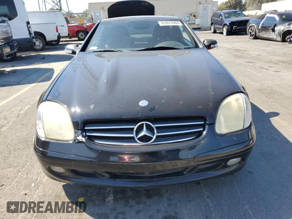 2001 Mercedes-Benz SLK-Class with VIN WDBKK65F71F175734, listed as a Copart auction lot 61874984 with 185,408 mi miles and Salvage Title. Bid and sale history available at carsss.com. Image 5.