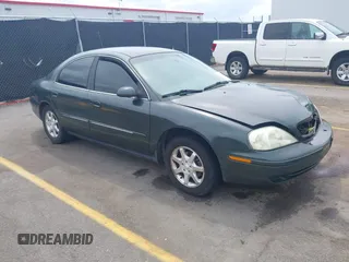2002 Mercury Sable GS z VIN 1MEFM50U22G652576, wystawiony jako IAAI lot #42079653 z przebiegiem 303 276 mil mil oraz . Historia ofert i sprzedaży dostępna na DreamBid. Obrazek 1.