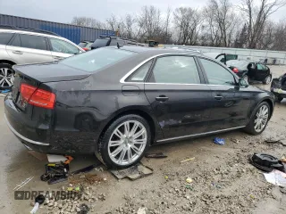 2014 Audi A8 3.0L TDI z VIN WAURMAFD3EN001307, wystawiony jako Copart lot #43476125 z przebiegiem 85 921 mil mil oraz Tytuł czysty. Historia ofert i sprzedaży dostępna na DreamBid. Obrazek 3.