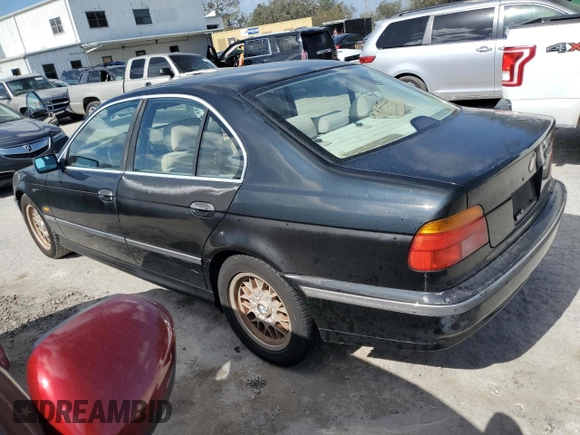2000 BMW 5 Series 528iA with VIN WBADM6340YGU16735, listed as a Copart auction lot 77249644 with 0 mi miles and Salvage Title. Bid and sale history available at carsss.com. Image 2.