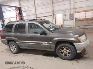 2000 Jeep Grand Cherokee Laredo z VIN 1J4GW48S1YC277710, wystawiony jako IAAI lot #42033564 z przebiegiem Nie podano mil oraz . Historia ofert i sprzedaży dostępna na DreamBid. Obrazek 13.