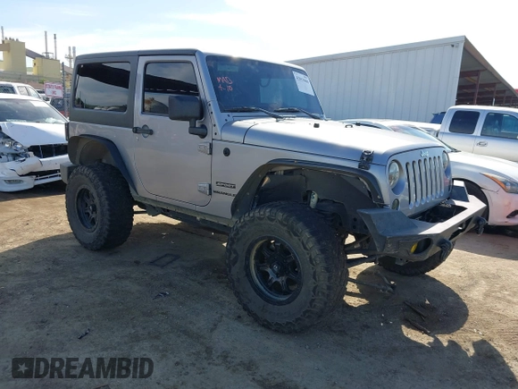 2014 Jeep Wrangler Sport with VIN 1C4AJWAG5EL206565, listed as a IAAI auction lot 42015000 with 90,129 mi miles and . Bid and sale history available at carsss.com. Image 1.