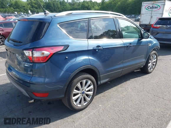 2018 Ford Escape Titanium with VIN 1FMCU9J92JUB01162, listed as a IAAI auction lot 42495112 with 96,280 mi miles and . Bid and sale history available at DreamBid. Image 4.