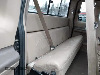1999 Ford Super Duty F-250 XL with VIN 1FTNX21F2XEC99584, listed as a IAAI auction lot 41611098 with 424,263 mi miles. Bid and sale history available at carsss.com. Image 8.