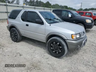2002 Isuzu Rodeo z VIN 4S2CK57W324328043, wystawiony jako Copart lot #54584025 z przebiegiem 141 523 mil mil oraz Szkody całkowita. Historia ofert i sprzedaży dostępna na DreamBid. Obrazek 4.