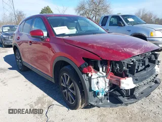 2018 Mazda CX-5 Grand Touring z VIN JM3KFBDM2J0317691, wystawiony jako IAAI lot #41144551 z przebiegiem Nie podano mil oraz . Historia ofert i sprzedaży dostępna na DreamBid. Obrazek 1.
