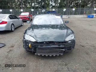 2013 Tesla Model S с VIN 5YJSA1CN1DFP27013, выставлен на аукционе IAAI как лот 42014212 с пробегом 65 858 миль миль и . История ставок и продаж доступна на DreamBid. Изображение 13.