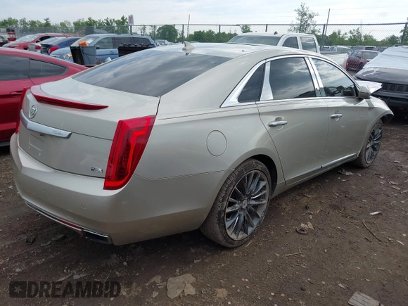 2014 Cadillac XTS Platinum z VIN 2G61T5S31E9209179, wystawiony jako IAAI lot #42241440 z przebiegiem 79 651 mil mil oraz . Historia ofert i sprzedaży dostępna na DreamBid. Obrazek 4.