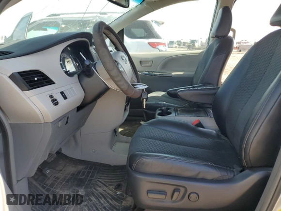 2014 Toyota Sienna SE with VIN 5TDXK3DC5ES454456, listed as a Copart auction lot 47098515 with 190,541 mi miles and Salvage Title. Bid and sale history available at DreamBid. Image 7.