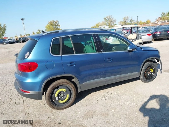 2017 Volkswagen Tiguan Wolfsburg Edition with VIN WVGRV7AX0HW502041, listed as a IAAI auction lot 31232130 with 30,214 mi miles. Bid and sale history available at carsss.com. Image 4.