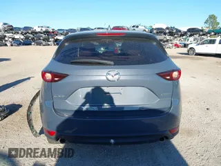 2021 Mazda CX-5 Touring with VIN JM3KFACM1M0371354, listed as a IAAI auction lot 40938490 with 56,172 mi miles. Bid and sale history available at carsss.com. Image 16.