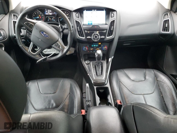 2016 Ford Focus Titanium z VIN 1FADP3N27GL329026, wystawiony jako Copart lot #60910475 z przebiegiem 98 794 mil mil oraz Szkoda całkowita • Salvage title. Historia ofert i sprzedaży dostępna na DreamBid. Obrazek 8.