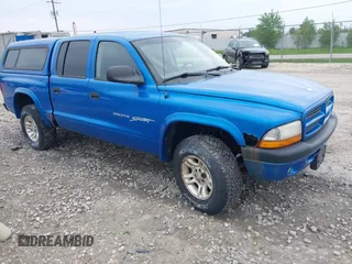 2001 Dodge Dakota Sport z VIN 1B7GG2AN91S214863, wystawiony jako IAAI lot #42440083 z przebiegiem 191 698 mil mil oraz . Historia ofert i sprzedaży dostępna na DreamBid. Obrazek 1.