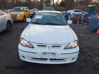 1999 Pontiac Grand Am GT with VIN 1G2NW12E3XM830305, listed as a IAAI auction lot 41797278 with 87,537 mi miles. Bid and sale history available at carsss.com. Image 6.