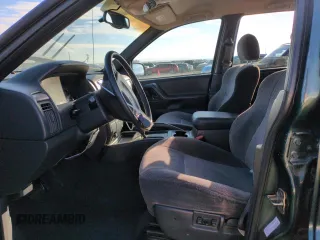 2001 Jeep Grand Cherokee Laredo with VIN 1J4GW48N21C570404, listed as a Copart auction lot 85996954 with 153,838 mi miles and Salvage Title. Bid and sale history available at carsss.com. Image 7.