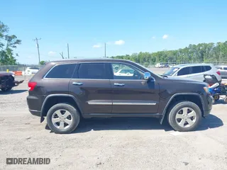 2011 Jeep Grand Cherokee Overland with VIN 1J4RR6GT1BC647292, listed as a IAAI auction lot 42069742 with 199,340 mi miles. Bid and sale history available at carsss.com. Image 13.