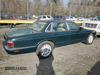 1998 Jaguar XJ with VIN SAJHX1241WC839104, listed as a Copart auction lot 81911744 with 61,956 mi miles and Clean title. Bid and sale history available at DreamBid. Image 3.