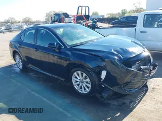 2019 Toyota Camry LE z VIN 4T1B11HK7KU845372, wystawiony jako IAAI lot #41892979 z przebiegiem 91 974 mil mil oraz . Historia ofert i sprzedaży dostępna na DreamBid. Obrazek 1.