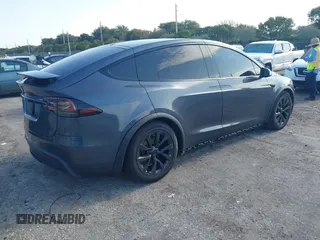 2022 Tesla Model X with VIN 7SAXCDE54NF342256, listed as a IAAI auction lot 41991212 with 28,740 mi miles and . Bid and sale history available at DreamBid. Image 4.