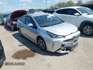 2021 Toyota Prius LE z VIN JTDL9MFU3M3028805, wystawiony jako IAAI lot #42043610 z przebiegiem 26 436 mil mil oraz . Historia ofert i sprzedaży dostępna na DreamBid. Obrazek 1.