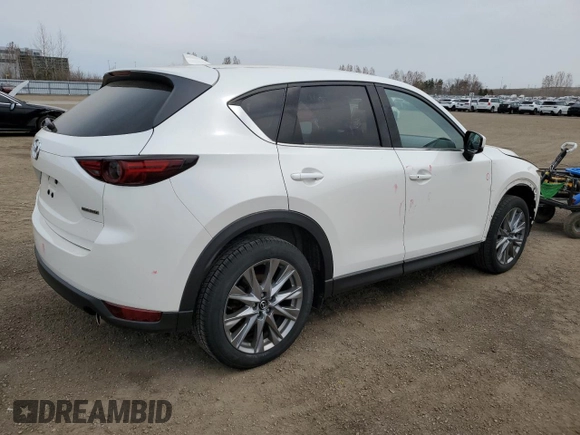 2021 Mazda CX-5 Grand Touring with VIN JM3KFBDM7M1122281, listed as a Copart auction lot 54576485 with 93,008 mi miles and Salvage Title. Bid and sale history available at DreamBid. Image 3.
