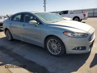 2014 Ford Fusion SE Hybrid with VIN 3FA6P0LUXER164566, listed as a Copart auction lot 64900635 with 181,728 mi miles and Clean title. Bid and sale history available at DreamBid. Image 4.