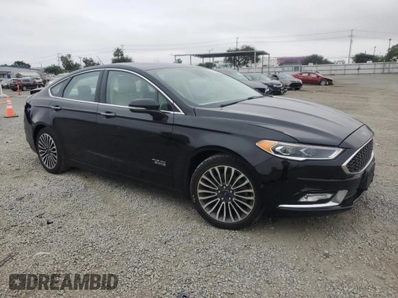 2017 Ford Fusion Titanium z VIN 3FA6P0SU5HR105415, wystawiony jako Copart lot #59779715 z przebiegiem 88 988 mil mil oraz Szkoda całkowita • Salvage title. Historia ofert i sprzedaży dostępna na DreamBid. Obrazek 4.