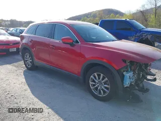 2019 Mazda CX-9 Touring with VIN JM3TCACY0K0310851, listed as a IAAI auction lot 42066395 with 91,046 mi miles and . Bid and sale history available at DreamBid. Image 1.