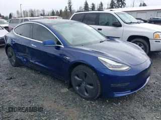 2019 Tesla Model 3 Long Range with VIN 5YJ3E1EB8KF512950, listed as a IAAI auction lot 41836349 with 55,607 mi miles and . Bid and sale history available at carsss.com. Image 1.