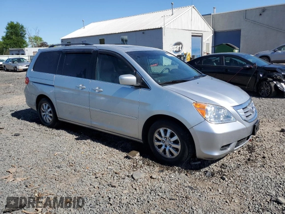 2010 Honda Odyssey EX-L with VIN 5FNRL3H76AB114542, listed as a Copart auction lot 54785425 with 104,239 mi miles and Salvage Title. Bid and sale history available at DreamBid. Image 4.