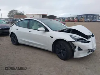 2022 Tesla Model 3 Long Range z VIN 5YJ3E1EB9NF115364, wystawiony jako IAAI lot #41618947 z przebiegiem 58 196 mil mil oraz . Historia ofert i sprzedaży dostępna na DreamBid. Obrazek 1.