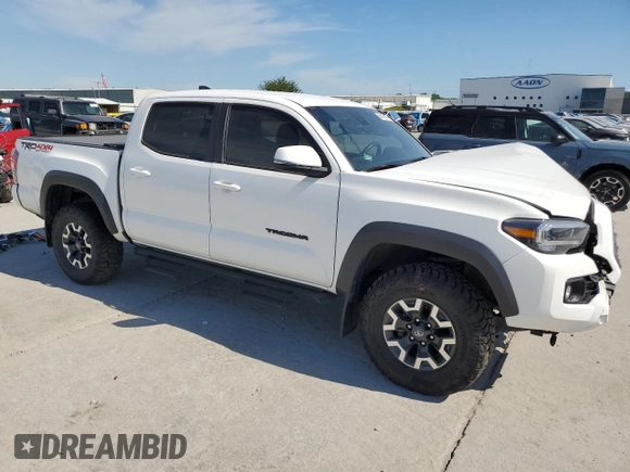 2023 Toyota Tacoma SR z VIN 3TMCZ5AN8PM589655, wystawiony jako Copart lot #56663615 z przebiegiem 43 327 mil mil oraz Szkoda całkowita • Salvage title. Historia ofert i sprzedaży dostępna na DreamBid. Obrazek 4.