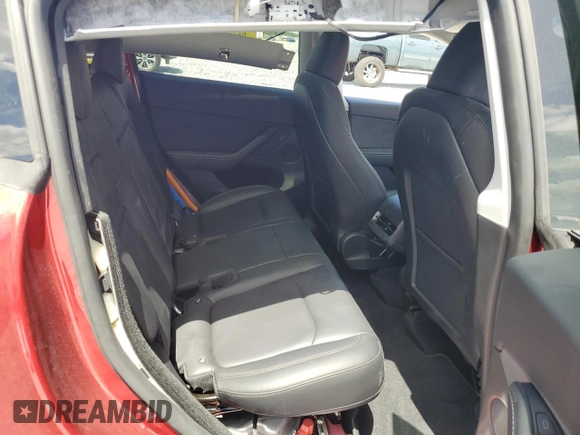 2024 Tesla Model Y Performance with VIN 7SAYGDEF1RF052175, listed as a Copart auction lot 51743895 with 4,869 mi miles and Salvage Title. Bid and sale history available at DreamBid. Image 10.