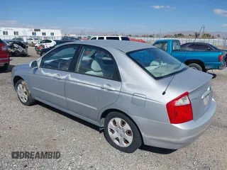 2004 Kia Spectra LX with VIN KNAFE122645052206, listed as a IAAI auction lot 41767864 with 63,866 mi miles. Bid and sale history available at carsss.com. Image 3.