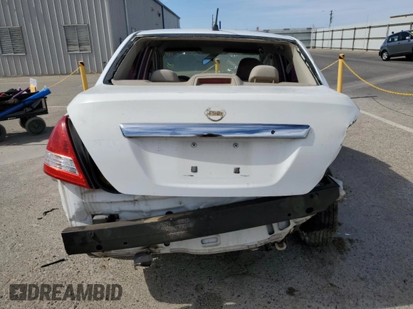 2009 Nissan Versa S z VIN 3N1BC11E79L501857, wystawiony jako Copart lot #58256025 z przebiegiem 156 313 mil mil oraz Szkoda całkowita • Salvage title. Historia ofert i sprzedaży dostępna na DreamBid. Obrazek 6.